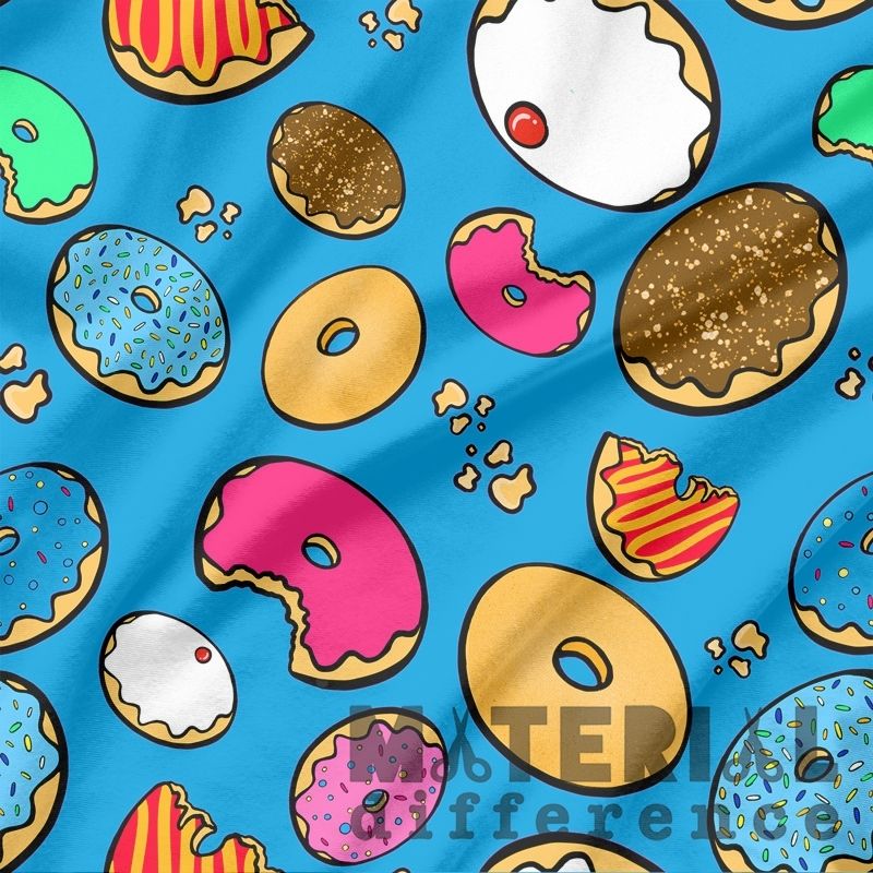 Colorful donut pattern on a blue fabric background with 'Material Difference' branding.