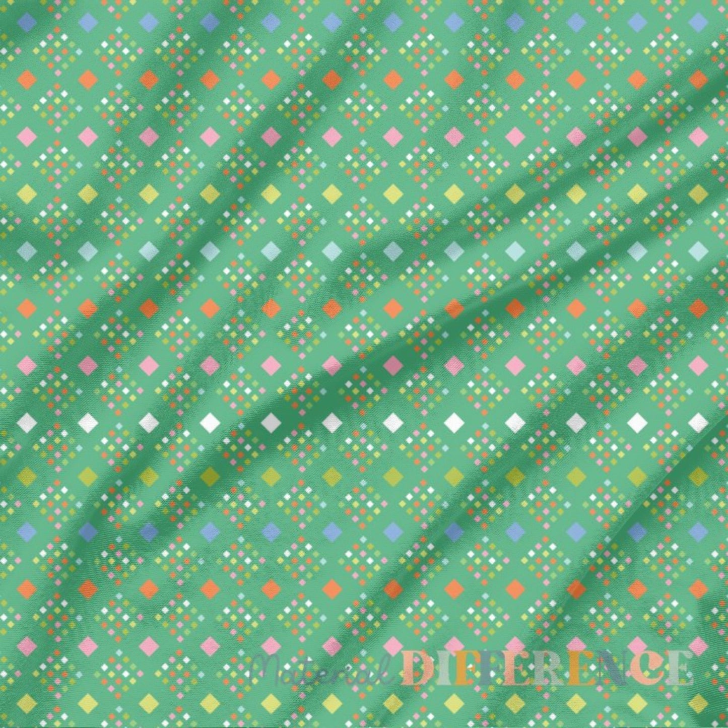 Colorful geometric pattern on green fabric with 'Material Difference' branding.