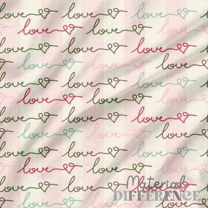 Handwritten words in cursive script saying LOVE on light pink and beige background