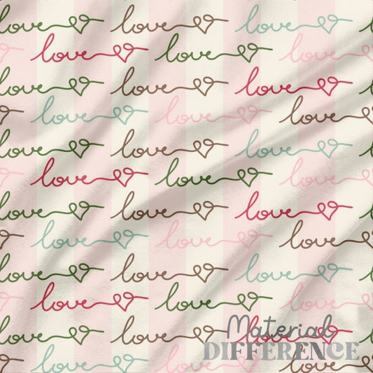 Handwritten words in cursive script saying LOVE on light pink and beige background