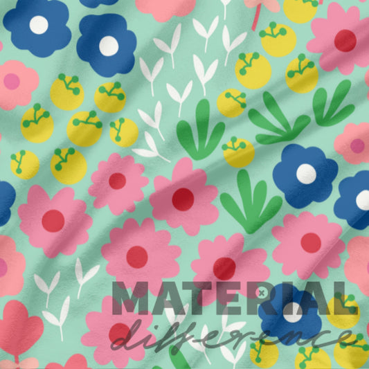 Colorful floral pattern with 'MATERIAL difference' text on a light green background
