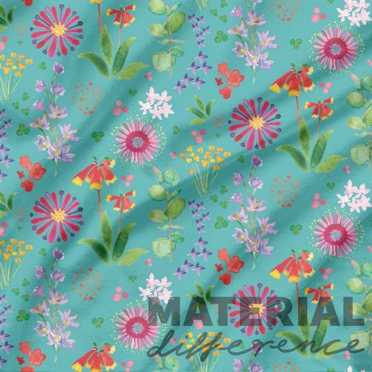 Colorful floral pattern on a teal turqouise background with 'MATERIAL difference' text.