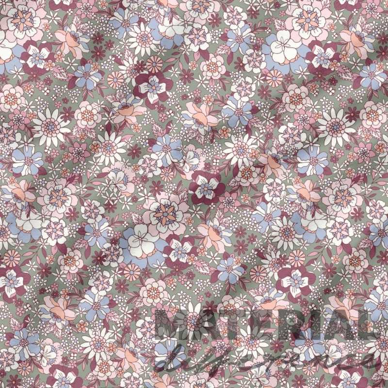 Floral patterned material with a mix of colors on a green background