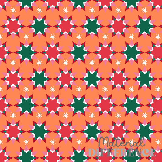 A repeating geometric pattern featuring orange starbursts, red six-pointed stars, green six-pointed stars, pink six-pointed stars, and small white starbursts. A translucent watermark reading 'Material Difference' is visible in the lower right corner.