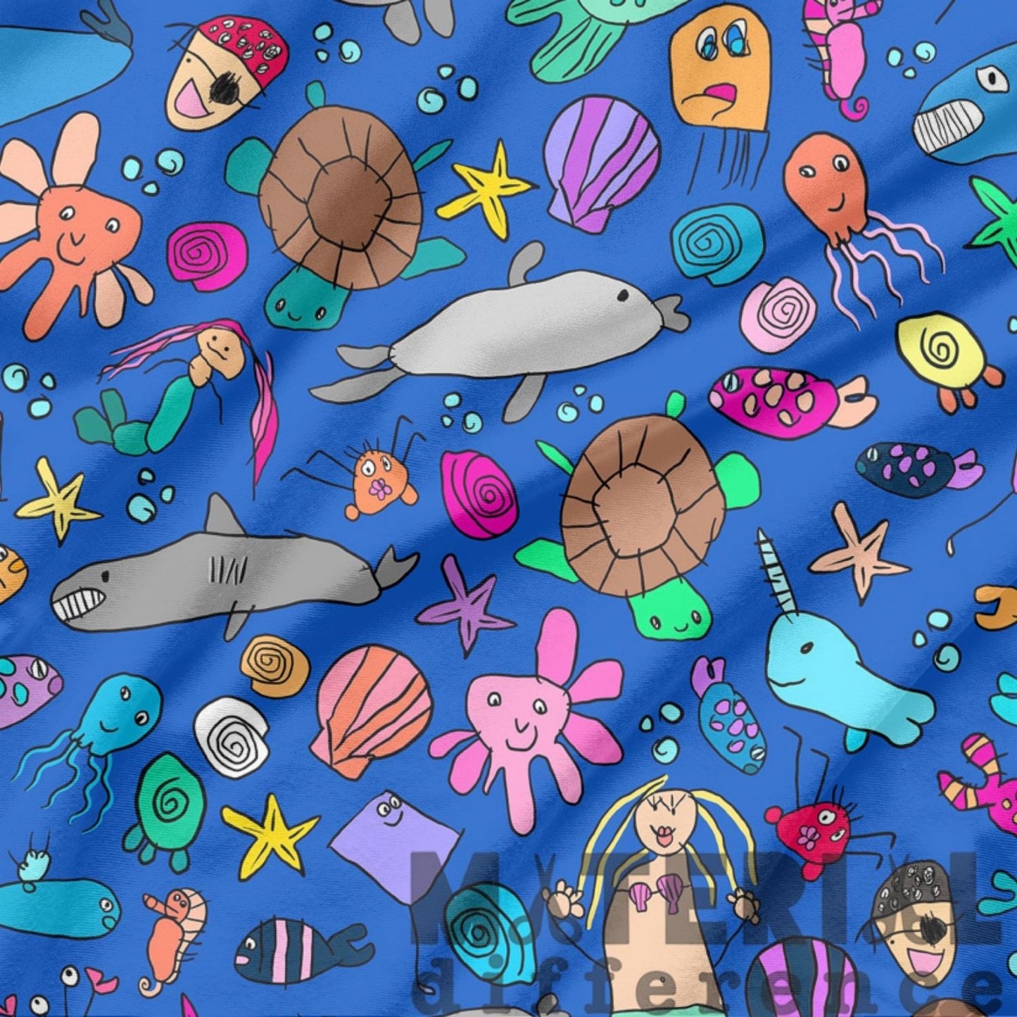 A close-up of a blue fabric with a colorful cartoon sea-creature print, including turtles, fish, starfish, jellyfish, and mermaids.
