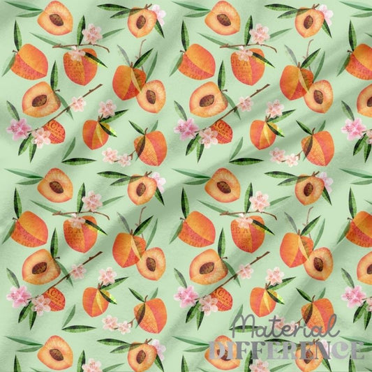 Whimsy peaches on a light green background with pink blossoms