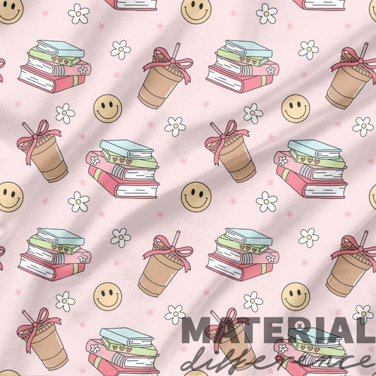 Pattern of books, coffee cups, and smiley faces on a pink background with 'Material Girl' text.