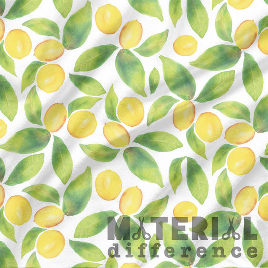 Pattern of yellow lemons and green leaves with 'Material Difference' text on a white background