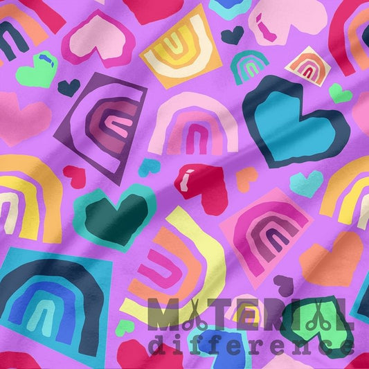 Colorful pattern of hearts and rainbows on a purple background with 'Material Difference' text.
