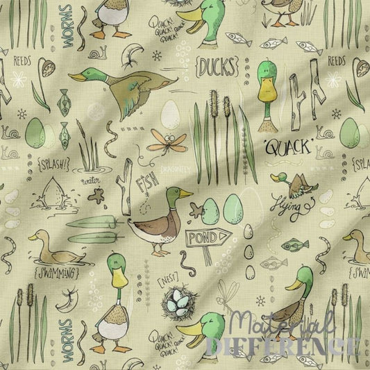 Patterned fabric with ducks, reeds, and other elements on a beige background