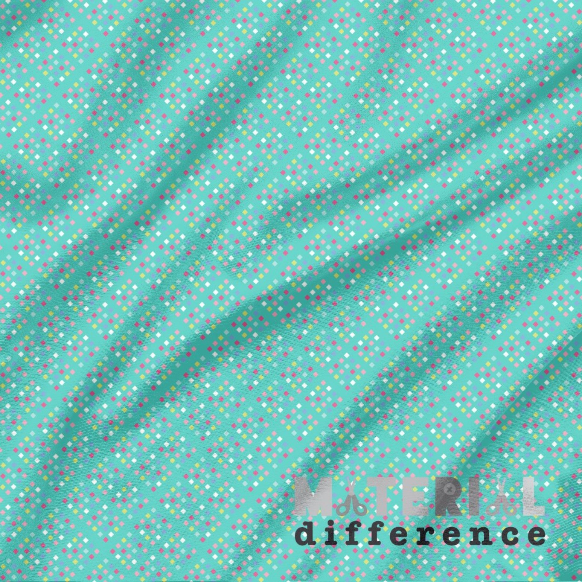 Fabric with small multicolored small diamonds on an aqua background, featuring the brand 'Material Difference'.