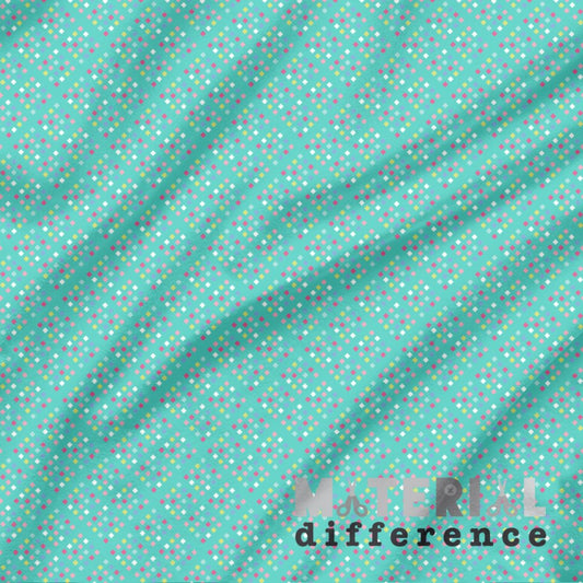 Fabric with small multicolored small diamonds on an aqua background, featuring the brand 'Material Difference'.