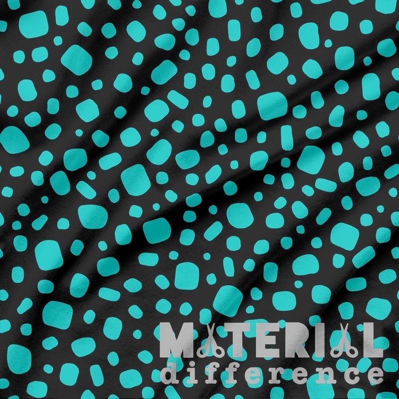 Fabric with blue and black pattern and 'Material Difference' branding.