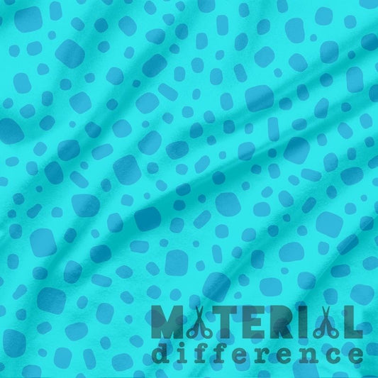 Blue polka dot fabric with 'Material Difference' logo