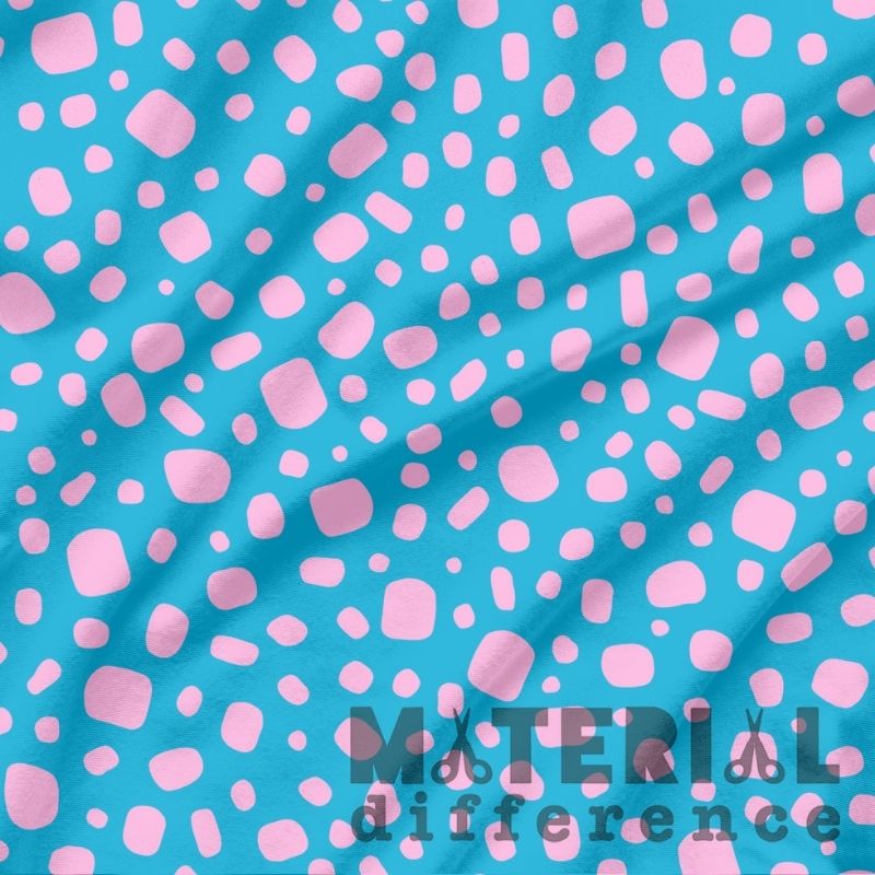 Fabric with pink abstract pattern on a blue background, featuring 'Material Difference' branding.