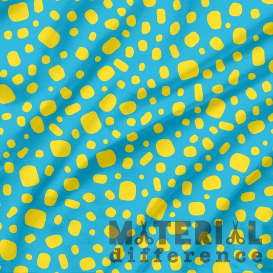 Blue fabric with yellow abstract pattern and 'Material Difference' text