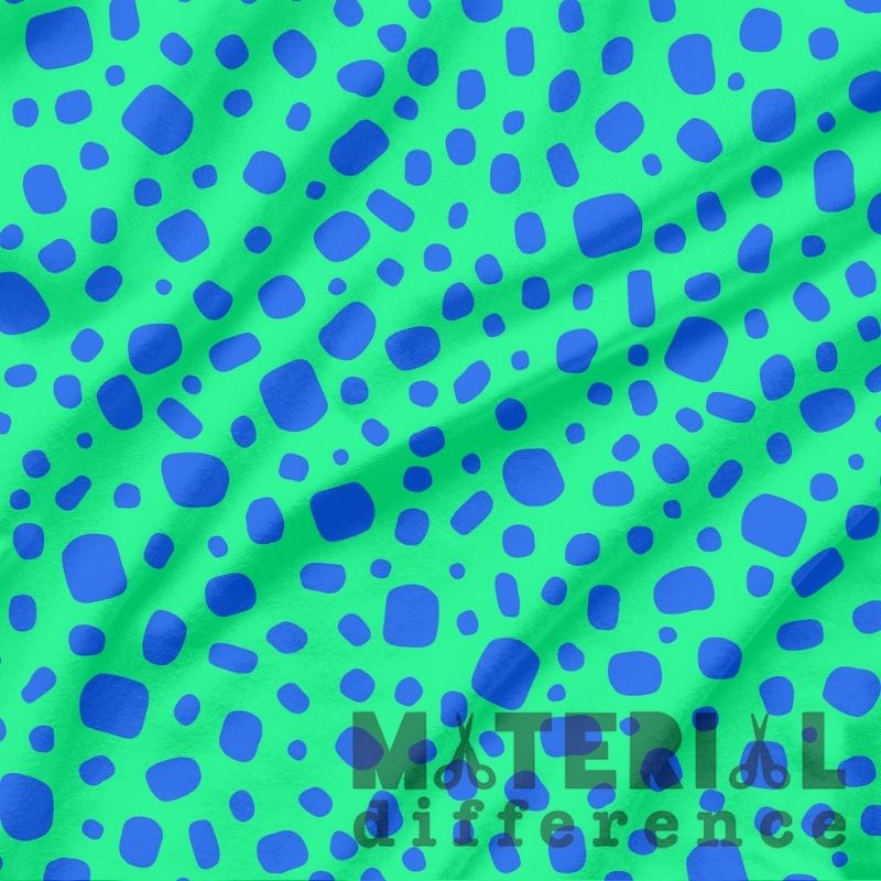 Green fabric with blue polka dot pattern and 'Material Difference' branding.