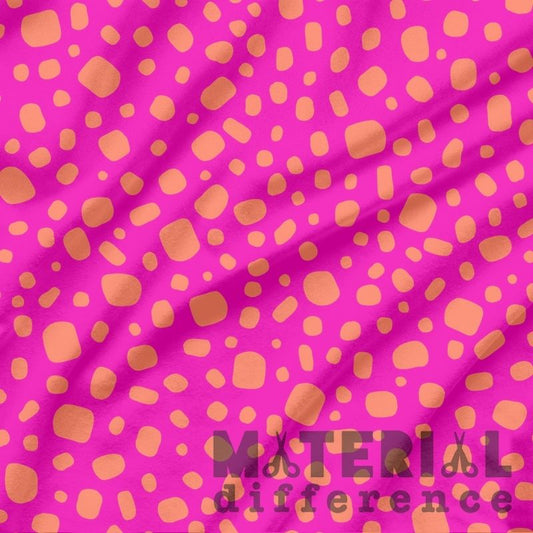 Pink fabric with orange polka dots and 'Material Difference' text.
