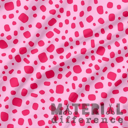 Pink fabric with red polka dots and 'Material Difference' text.