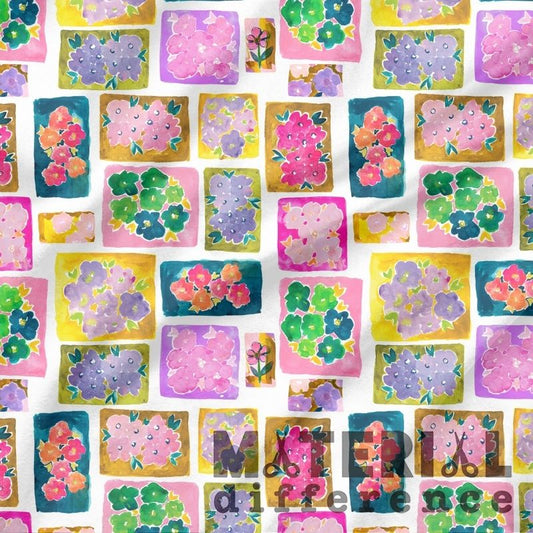 Pattern of colorful floral stickers on a white background