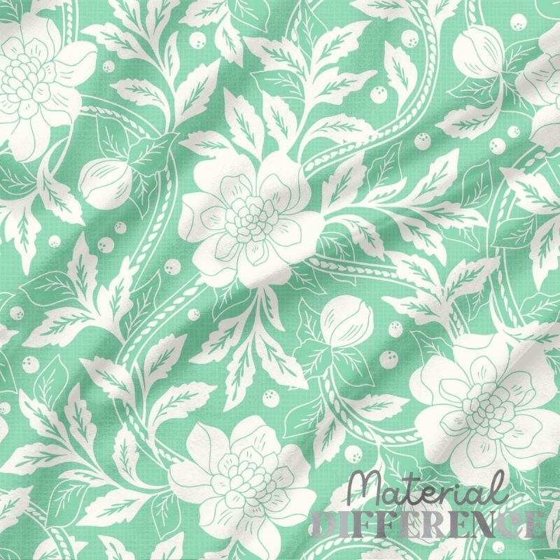 Floral pattern with white flowers and leaves on a green background, featuring 'Material Difference' branding.