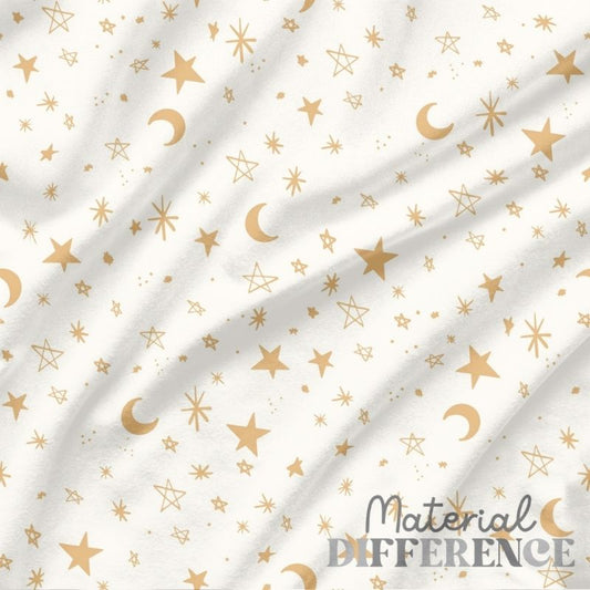White fabric with gold stars and crescent moons pattern, featuring 'Material Difference' branding.